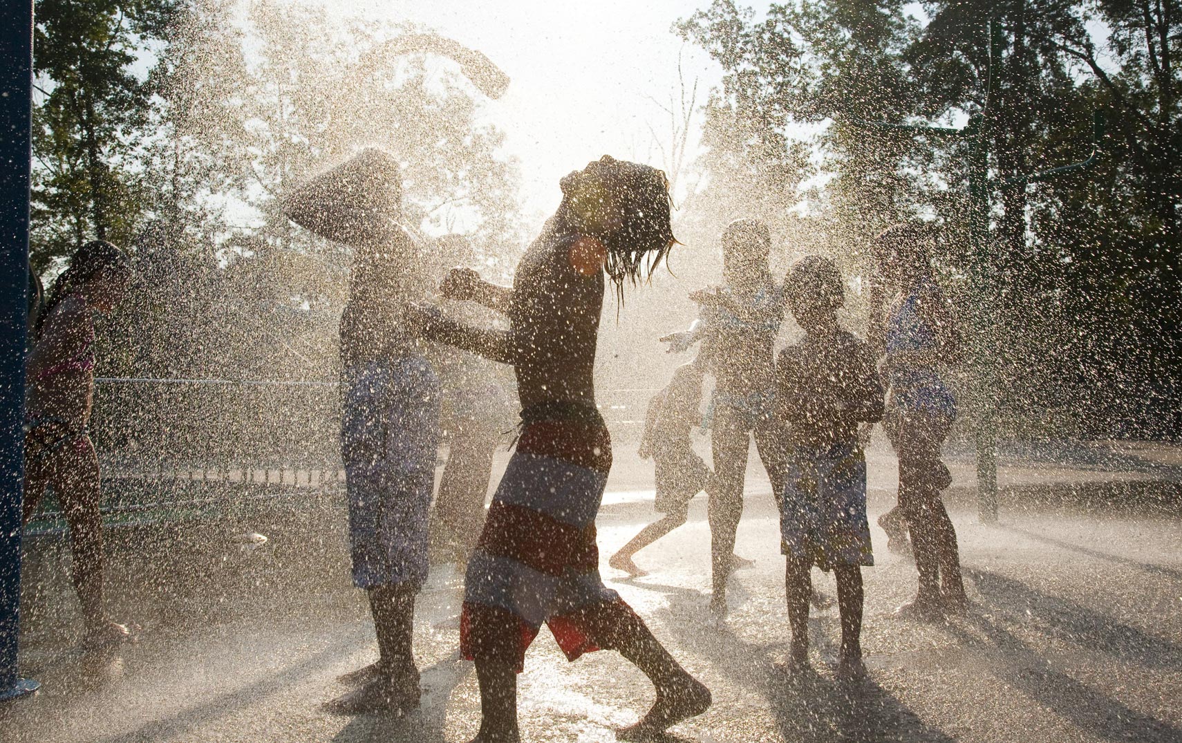 Children playing in sprinklers